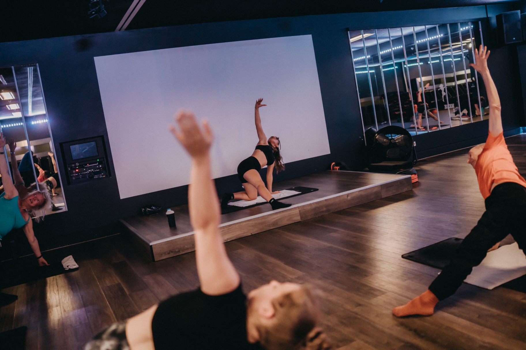 Guided pilates side stretch in the studio